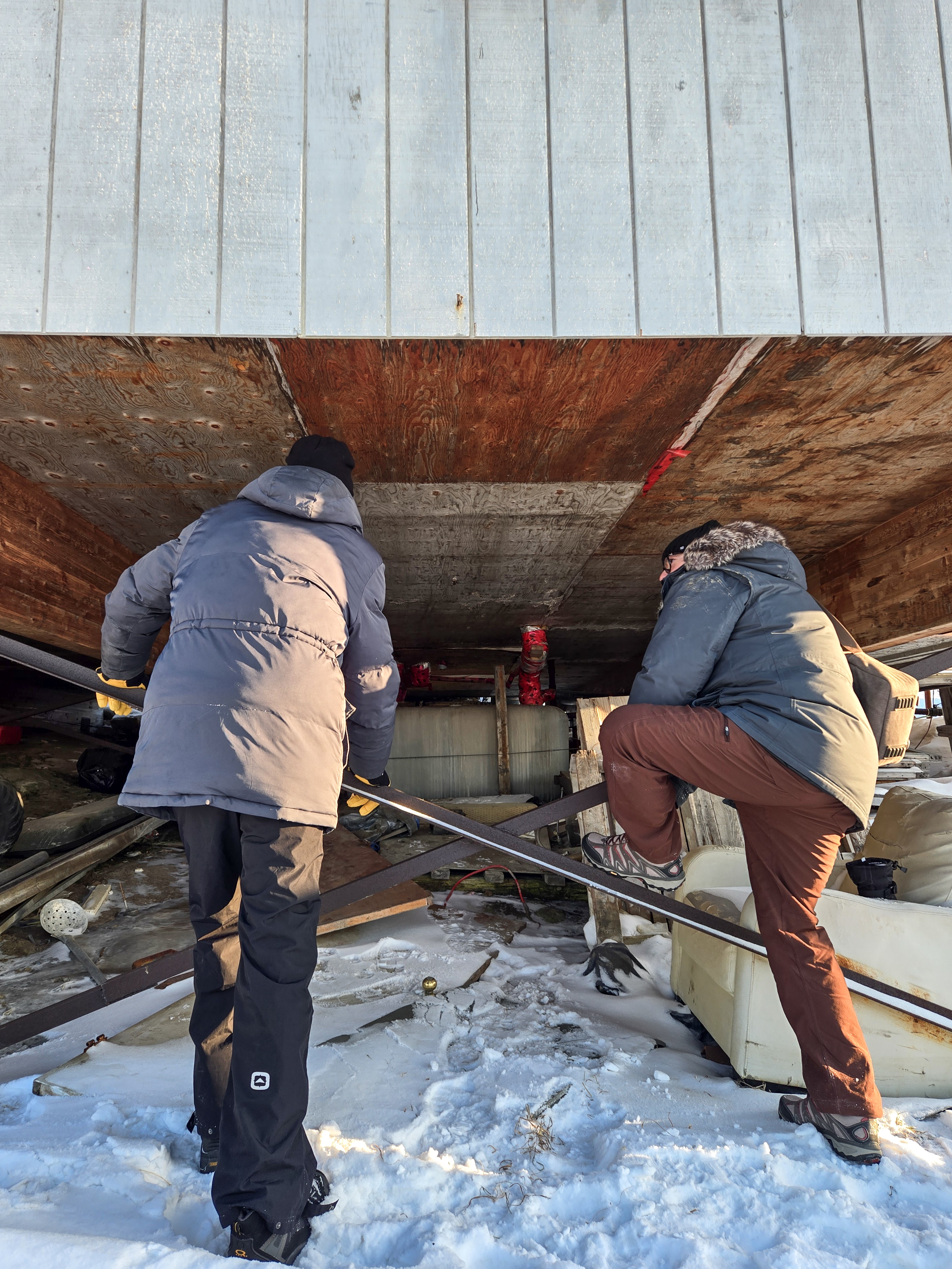 CLEAResult’s Ross Elliot and Sean Kelly check out a home’s insulation
