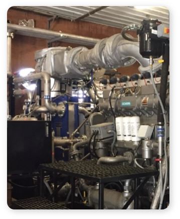 A 335 kW engine generates power and heat for the dairy farm from the farm's waste.